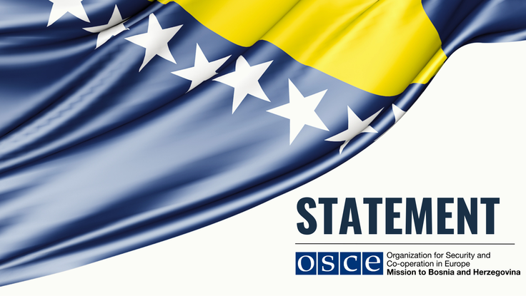 Wavy blue flag with white stars and yellow stripe, text "STATEMENT" and OSCE logo.