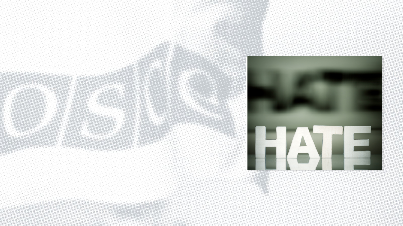 Block letters spelling "HATE" on a reflective surface, blurred background.